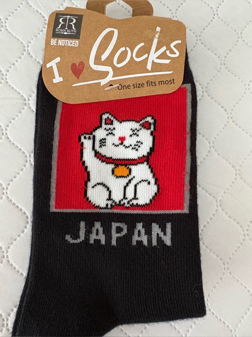 Robin Ruth black socks feature a Japanese maneki-neko "lucky cat" design